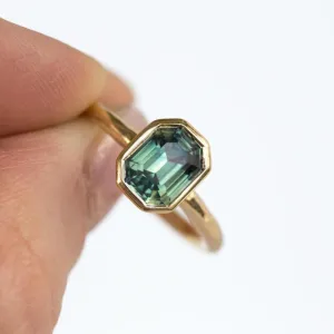 2.12ct Light Teal Emerald Cut Sapphire Bezel Evergreen Setting 14k Yellow Gold Low Profile