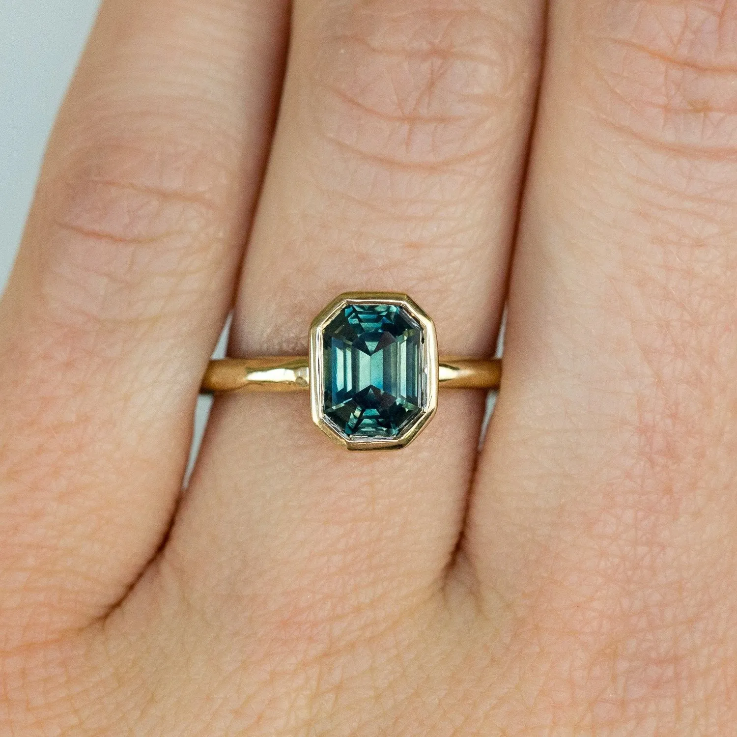 2.12ct Light Teal Emerald Cut Sapphire Bezel Evergreen Setting 14k Yellow Gold Low Profile